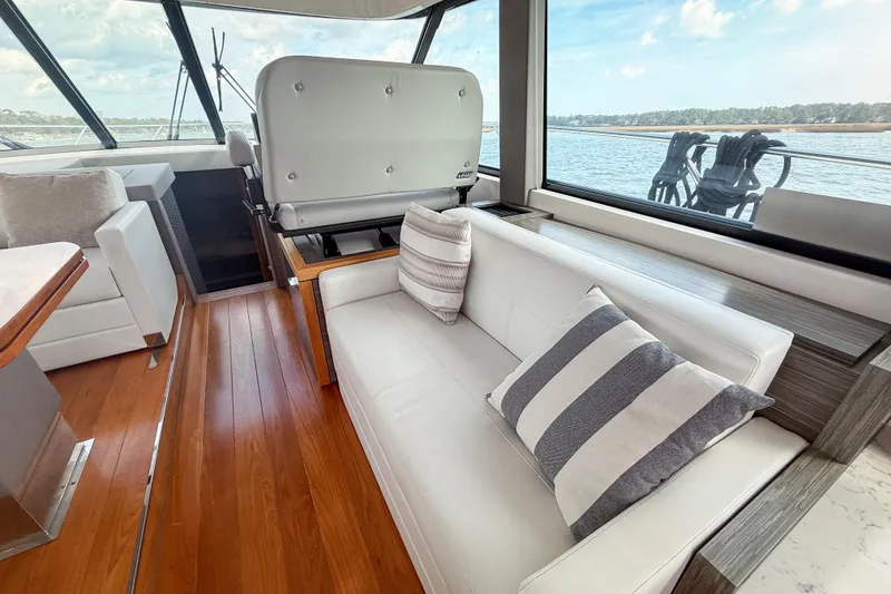 Slide: The Image of Luxurious interior of 2019 Tiara Yachts F53 Flybridge with elegant seating and scenic views. - 69