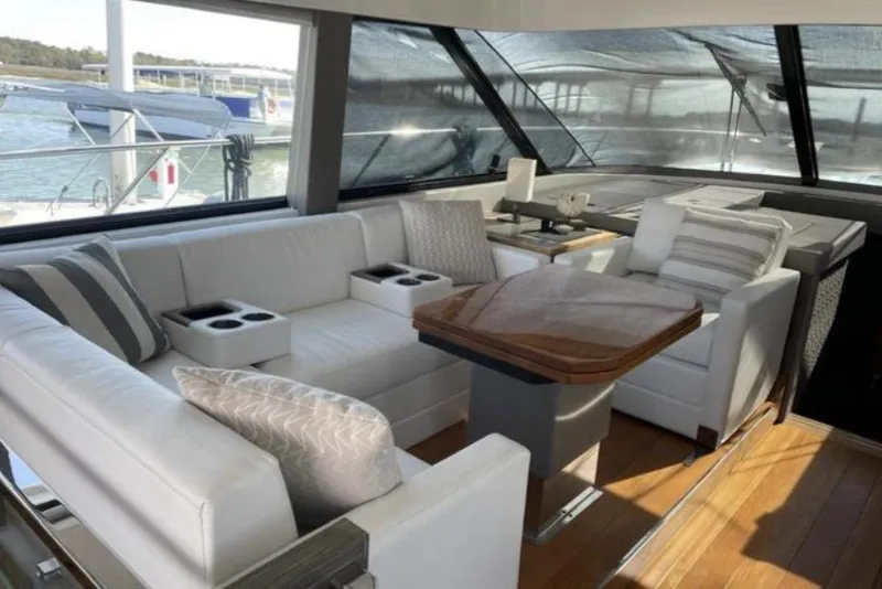 Slide: The Image of 2019 Tiara Yachts F53 Flybridge cruising on open water. - 7