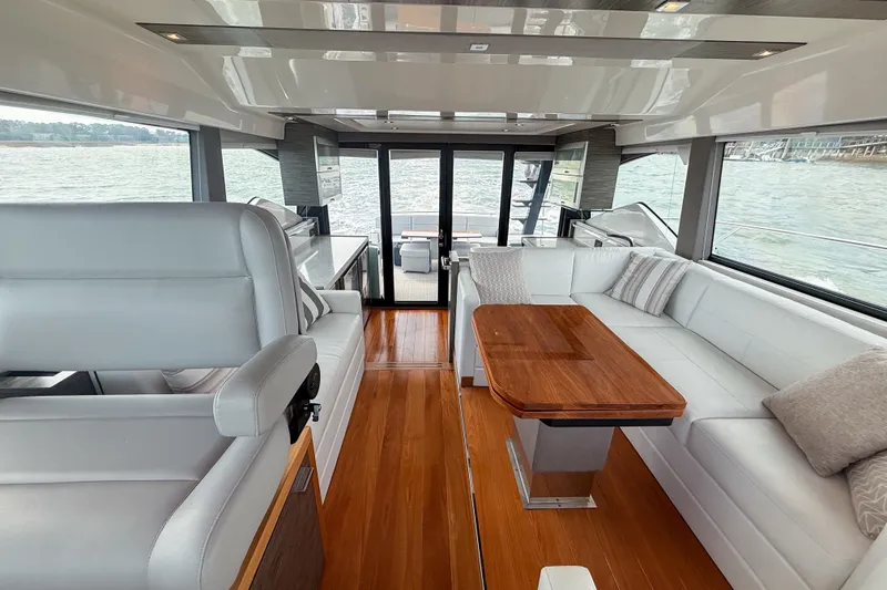 Slide: The Image of Luxurious interior of 2019 Tiara Yachts F53 Flybridge with elegant seating and wooden table. - 73