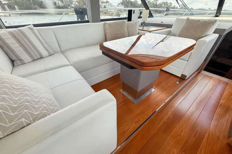 Slide: The Image of Luxurious interior of 2019 Tiara Yachts F53 Flybridge with elegant seating and wooden table. - 77