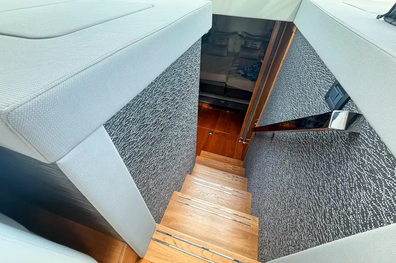 Slide: The Image of Staircase leading to cabin interior of 2019 Tiara Yachts F53 Flybridge. - 82