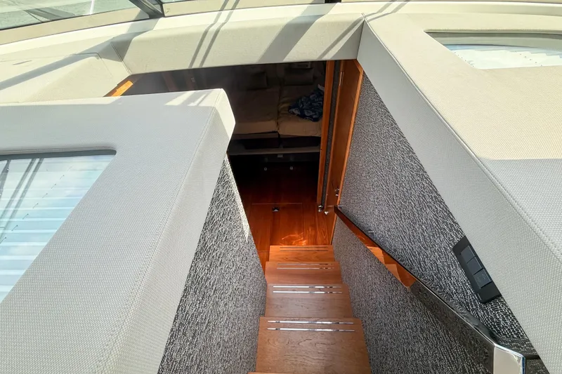 Slide: The Image of Staircase leading to cabin interior of 2019 Tiara Yachts F53 Flybridge. - 87