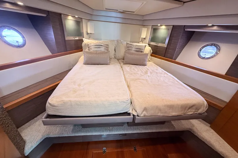Slide: The Image of Luxurious bedroom interior of 2019 Tiara Yachts F53 Flybridge with elegant bedding. - 92
