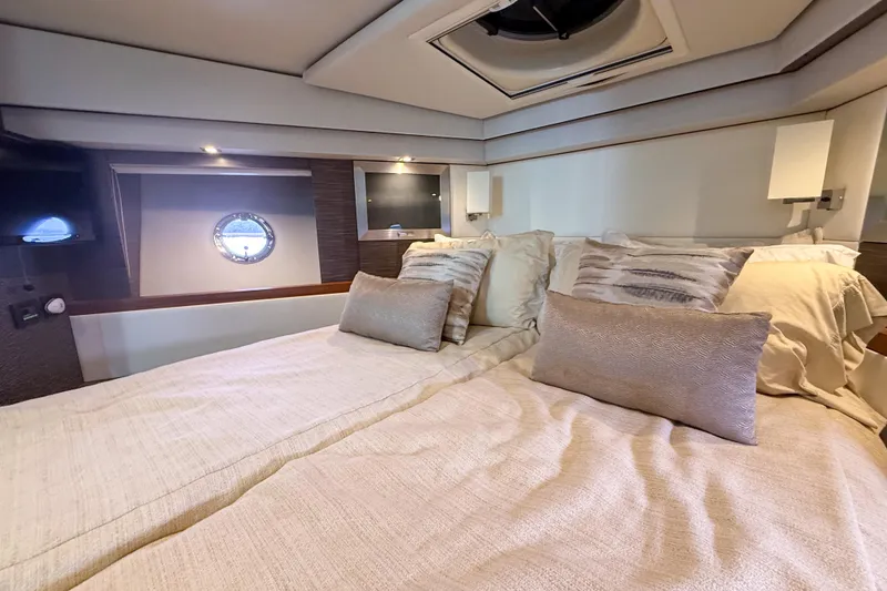 Slide: The Image of Luxurious bedroom interior of 2019 Tiara Yachts F53 Flybridge with elegant bedding. - 95
