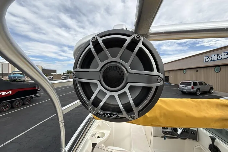 Slide: The Image of JL Audio speaker on 2005 Monterey 233 Explorer Sport boat, parked outdoors. - 21