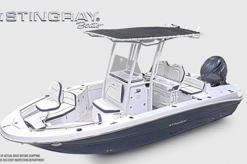 Slide: The Image of 2026 Stingray 211 DC boat with T-top and Yamaha outboard motor. - 2
