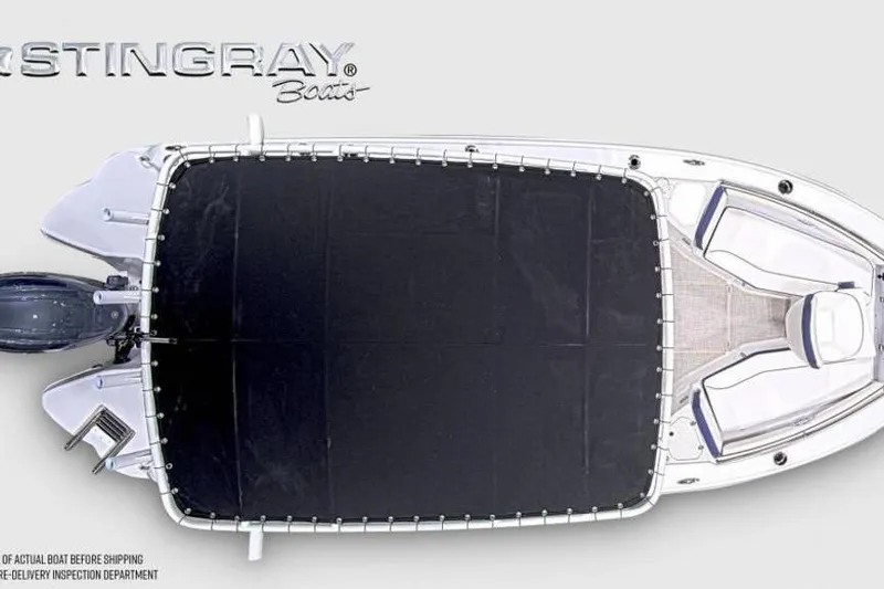 Slide: The Image of Top view of 2026 Stingray 211 DC boat with cover, showcasing sleek design. - 7