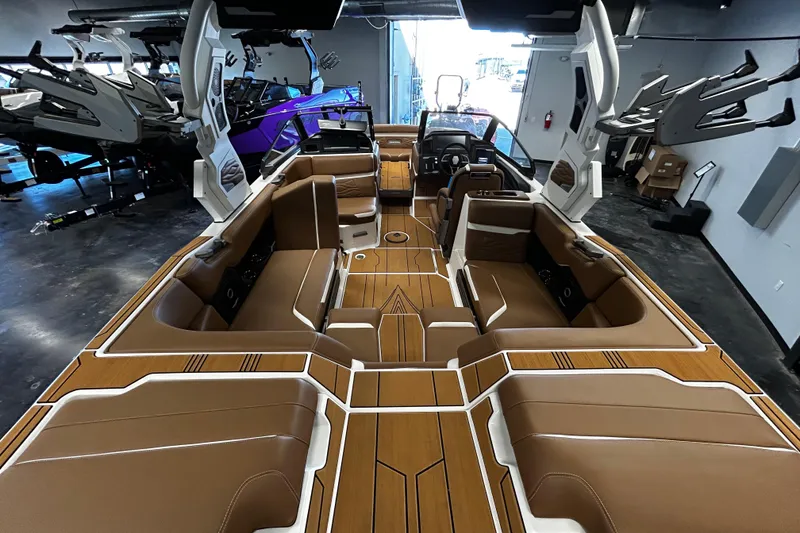 Slide: The Image of 2025 Supra SA boat interior with luxurious brown seating and modern design elements. - 3