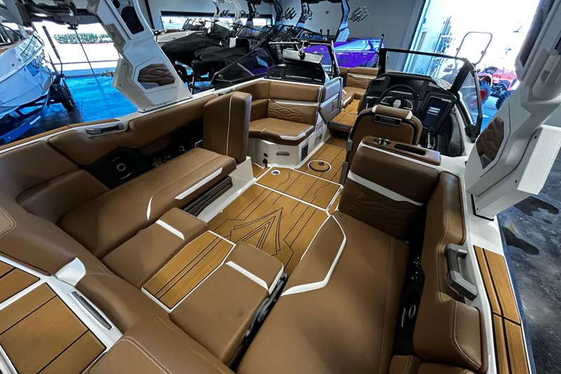 Slide: The Image of Luxurious interior of 2025 Supra SA boat with brown leather seating and modern design. - 4