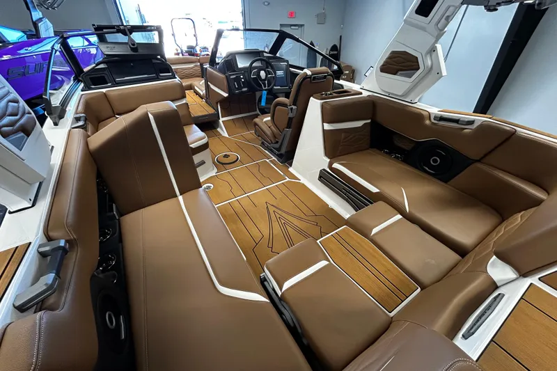 Slide: The Image of 2025 Supra SA boat interior with luxurious brown seating and modern design elements. - 5
