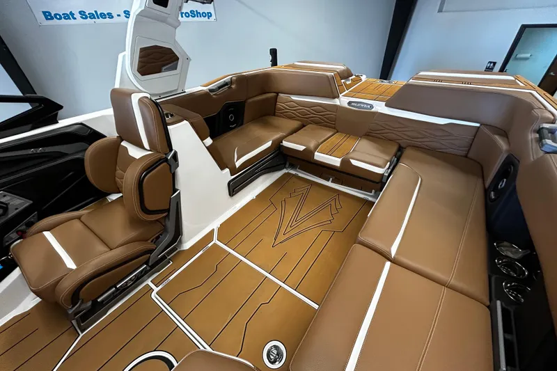 Slide: The Image of Luxurious interior of 2025 Supra SA boat with brown leather seating and modern design. - 6