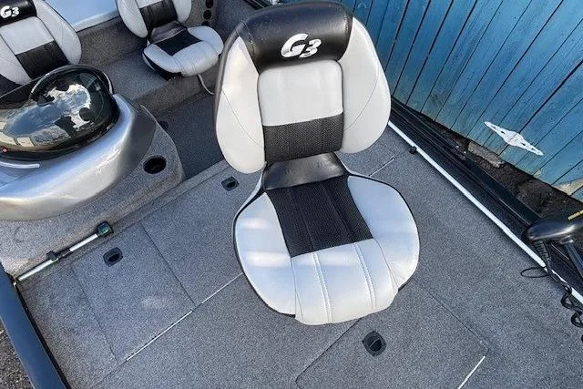 Slide: The Image of 2014 G3 Eagle 166 SE boat interior with gray and black seating. - 12