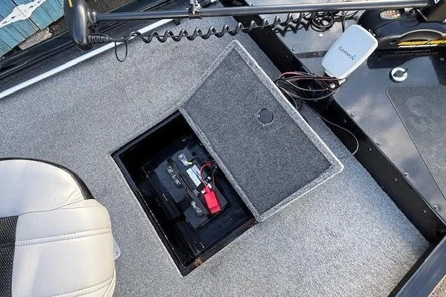 Slide: The Image of 2014 G3 Eagle 166 SE boat battery compartment with Garmin device and seating. - 13