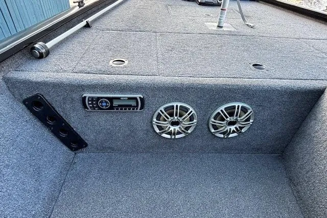 Slide: The Image of 2014 G3 Eagle 166 SE boat interior with stereo system and speakers. - 15