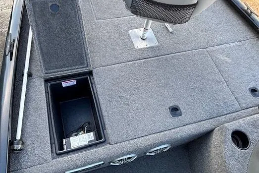 Slide: The Image of 2014 G3 Eagle 166 SE boat interior with storage compartment and seating. - 16