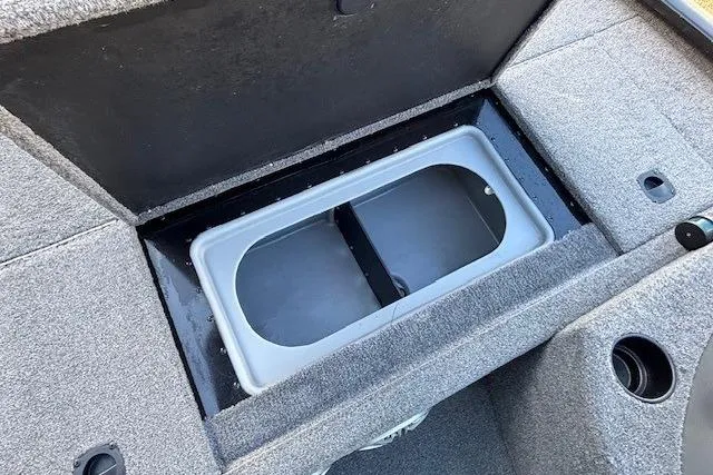 Slide: The Image of 2014 G3 Eagle 166 SE boat storage compartment with gray interior. - 18