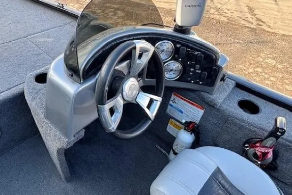 Slide: The Image of 2014 G3 Eagle 166 SE boat dashboard with steering wheel and Garmin device. - 20