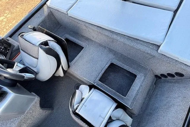 Slide: The Image of Interior of 2014 G3 Eagle 166 SE boat with seating and storage compartments. - 24