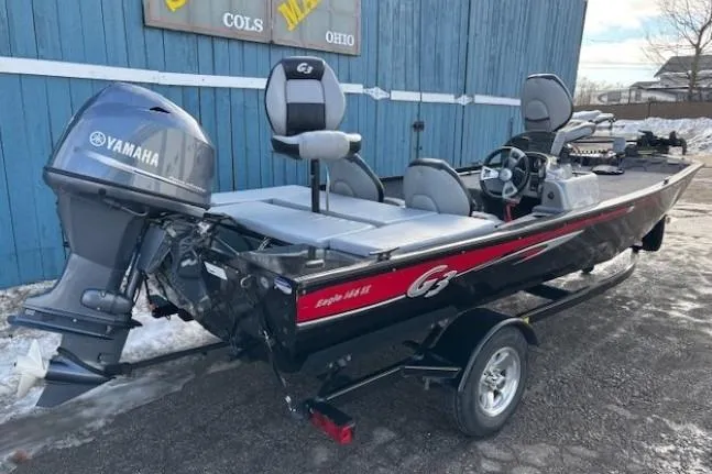 Slide: The Image of 2014 G3 Eagle 166 SE fishing boat with Yamaha motor, parked outdoors. - 3