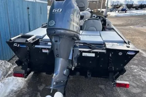 Slide: The Image of 2014 G3 Eagle 166 SE boat with Yamaha 60HP outboard motor, parked on snowy ground. - 4