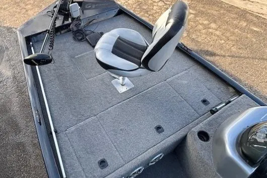 Slide: The Image of 2014 G3 Eagle 166 SE boat interior with swivel seat and carpeted deck. - 8