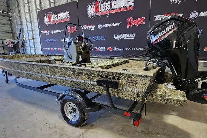 Slide: The Image of 2025 Tracker Grizzly 1860 CC boat with Mercury engine on display in showroom. - 4