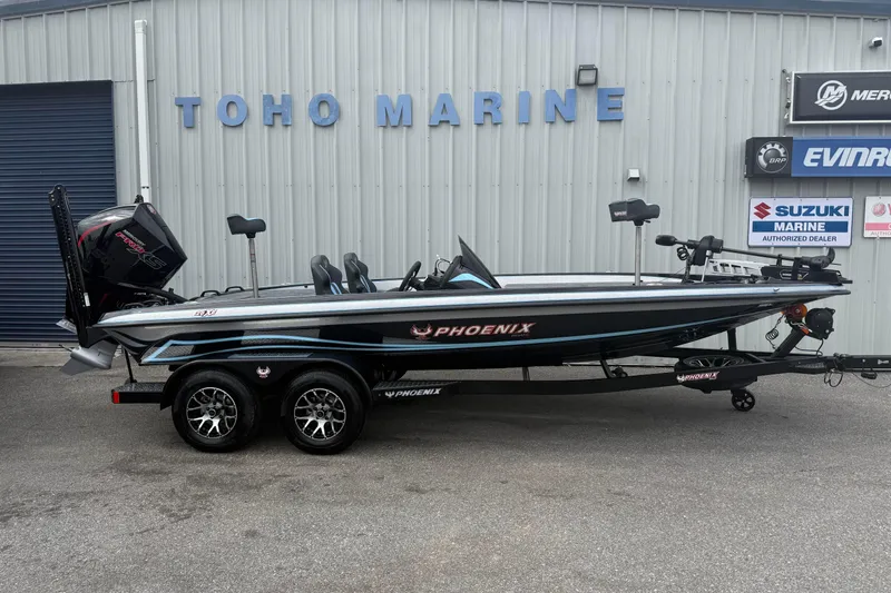 Slide: The Image of 2026 Phoenix 20 XE boat at Toho Marine dealership, featuring sleek design and modern equipment. - 1