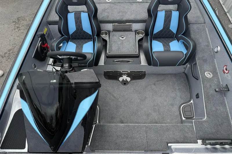 Slide: The Image of 2026 Phoenix 20 XE boat interior with blue and black seats, steering wheel, and console. - 10
