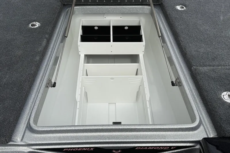 Slide: The Image of Open storage compartment in 2026 Phoenix 20 XE boat, featuring organized interior layout. - 15