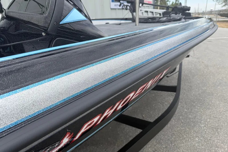 Slide: The Image of 2026 Phoenix 20 XE boat with sleek design and metallic accents. - 2