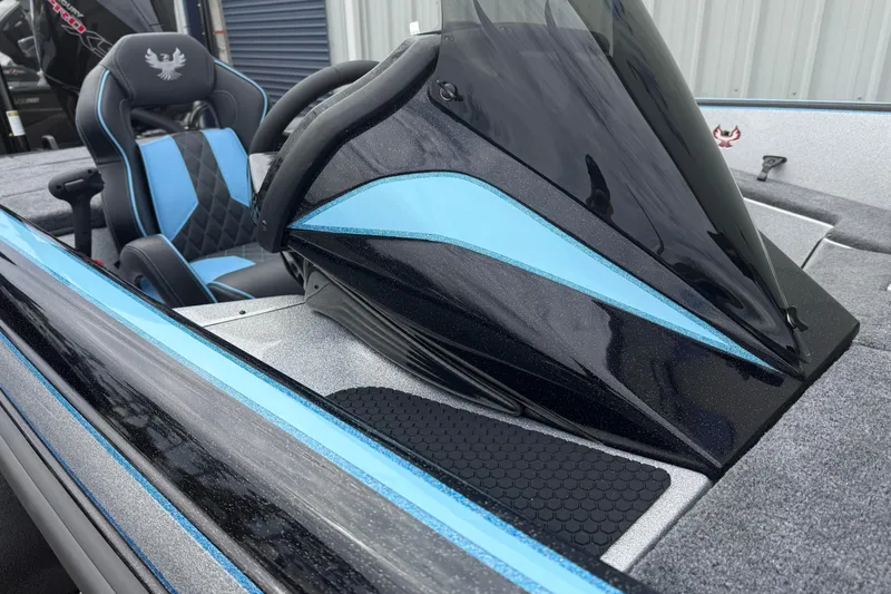 Slide: The Image of 2026 Phoenix 20 XE boat interior with sleek black and blue design, featuring a comfortable seat. - 4