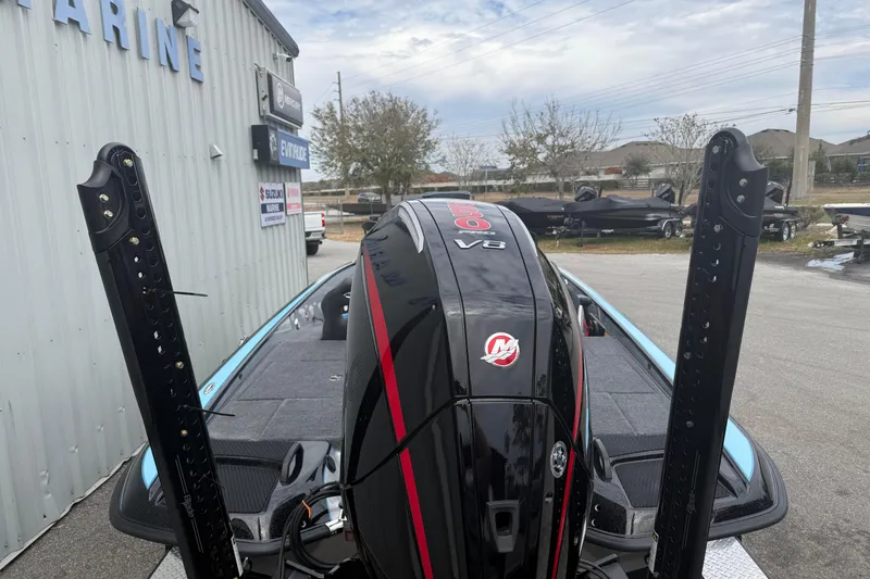 Slide: The Image of 2026 Phoenix 20 XE boat with powerful V8 engine at a marine dealership. - 5