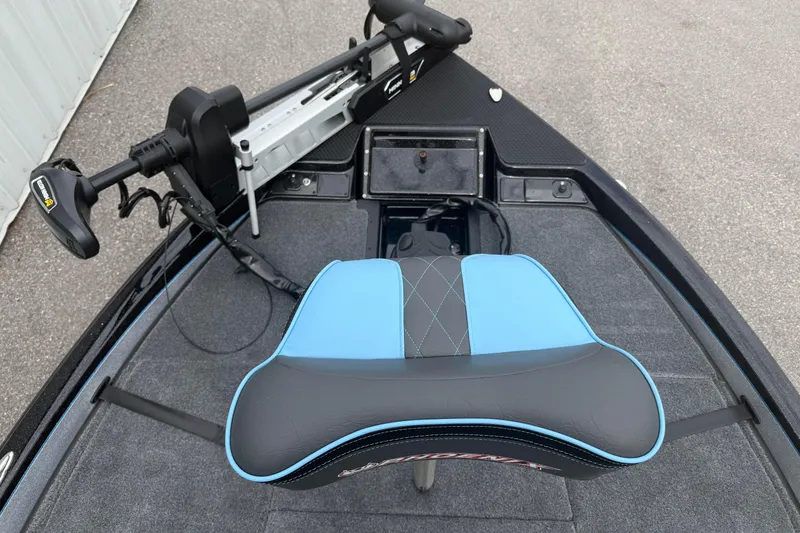 Slide: The Image of 2026 Phoenix 20 XE boat interior with blue and black seat and trolling motor. - 9