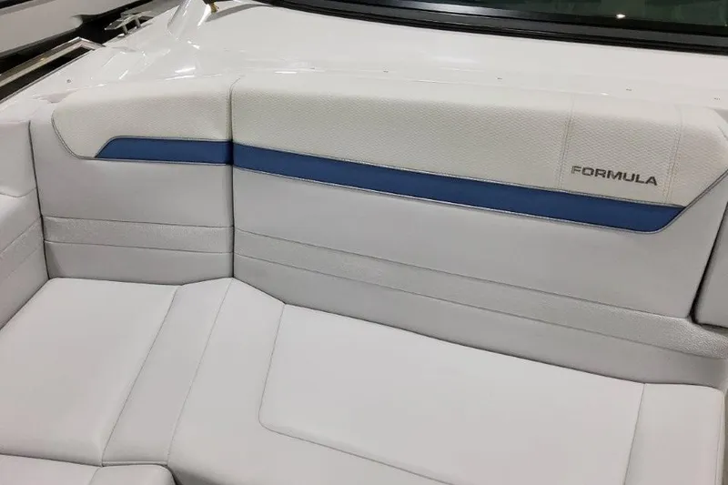 Slide: The Image of 2026 Formula 360 Crossover Bowrider I/O interior seating with white and blue upholstery. - 11