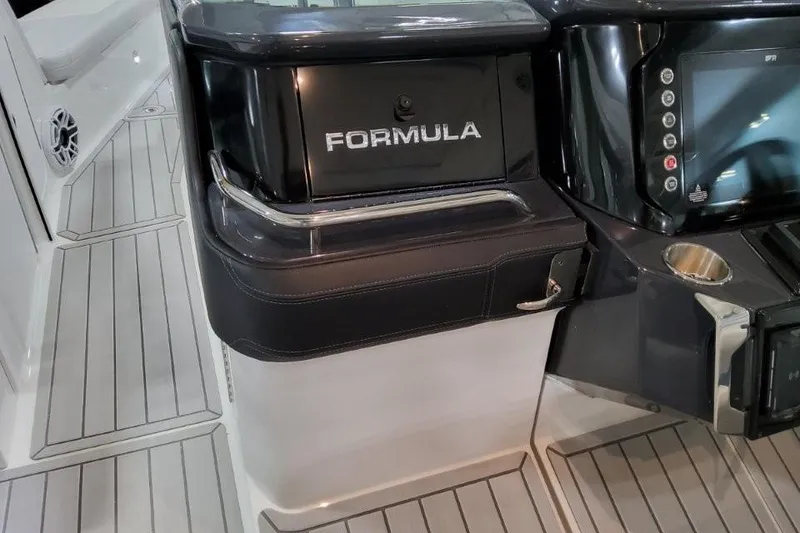 Slide: The Image of 2026 Formula 360 Crossover Bowrider I/O interior with sleek dashboard and controls. - 17