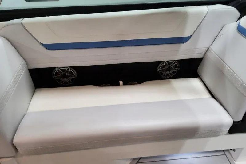 Slide: The Image of 2026 Formula 360 Crossover Bowrider I/O interior seating with speakers, featuring white and blue accents. - 18