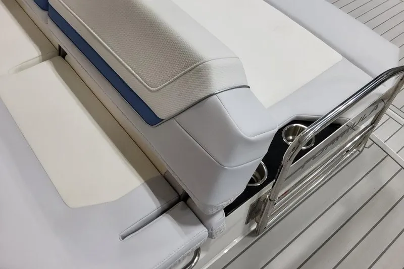 Slide: The Image of 2026 Formula 360 Crossover Bowrider I/O interior seating with stainless steel accents and cup holders. - 21