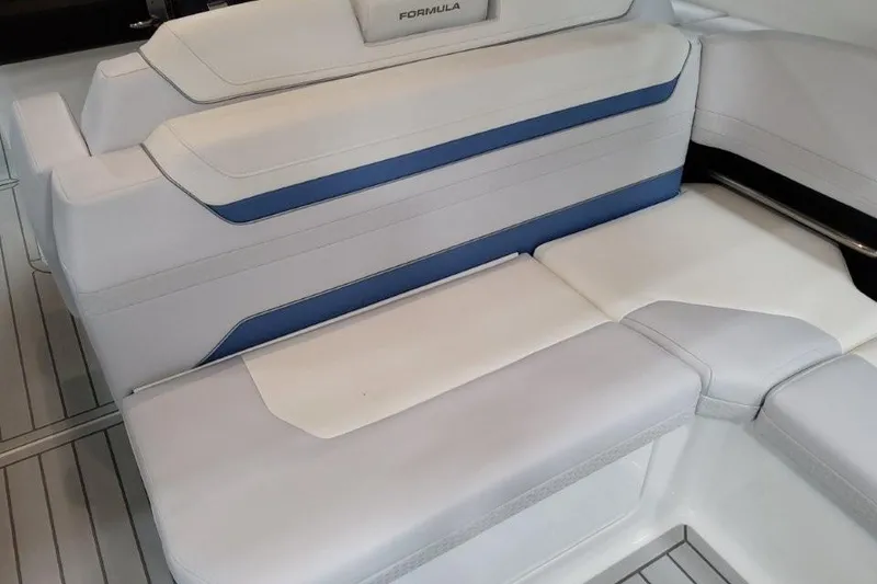 Slide: The Image of 2026 Formula 360 Crossover Bowrider I/O interior seating with white and blue upholstery. - 27