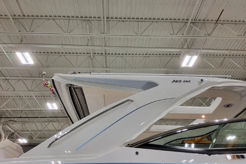 Slide: The Image of 2026 Formula 360 Crossover Bowrider I/O in showroom, sleek design under bright lights. - 3