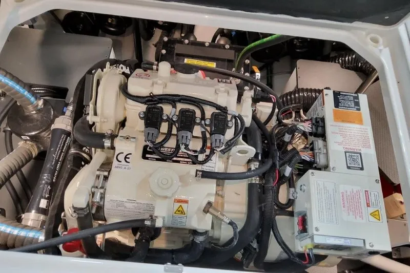 Slide: The Image of Engine compartment of 2026 Formula 360 Crossover Bowrider I/O, showcasing intricate wiring and components. - 31