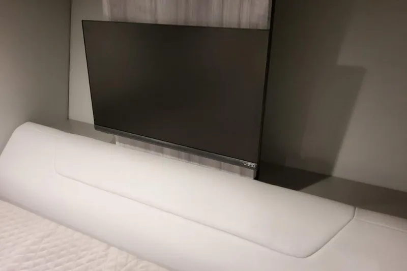 Slide: The Image of Interior of 2026 Formula 360 Crossover Bowrider I/O with modern TV setup. - 43