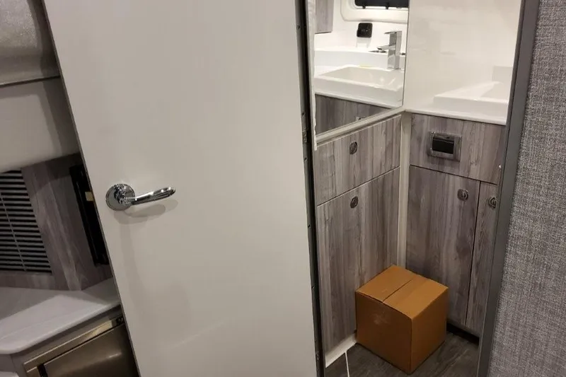 Slide: The Image of Interior of 2026 Formula 360 Crossover Bowrider I/O, featuring modern cabinetry and compact design. - 44