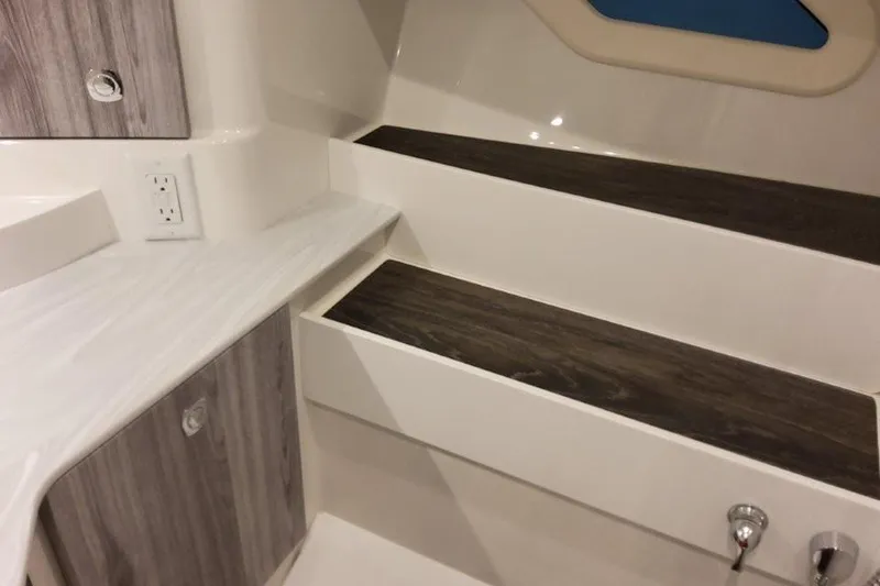 Slide: The Image of Interior of 2026 Formula 360 Crossover Bowrider I/O, featuring sleek wood accents and modern design. - 48