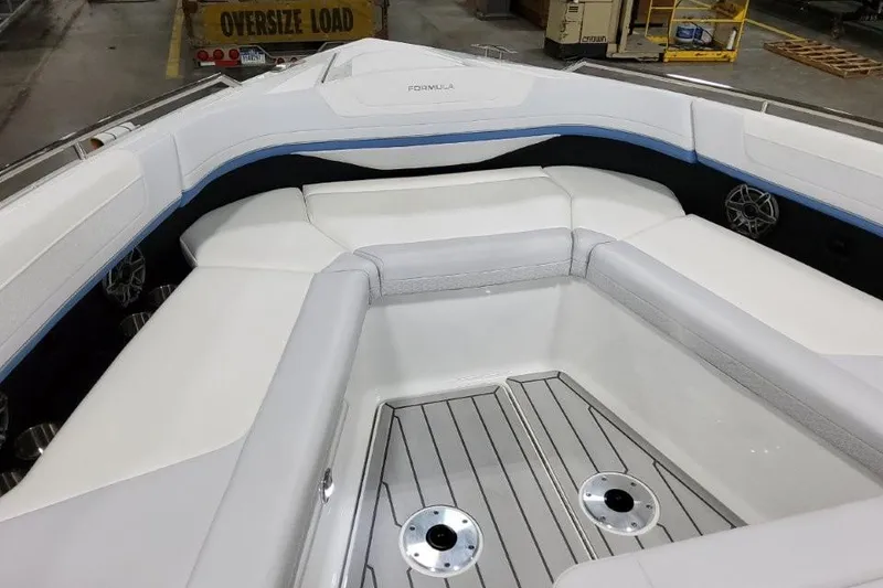 Slide: The Image of 2026 Formula 360 Crossover Bowrider I/O interior with white seating and sleek design. - 9