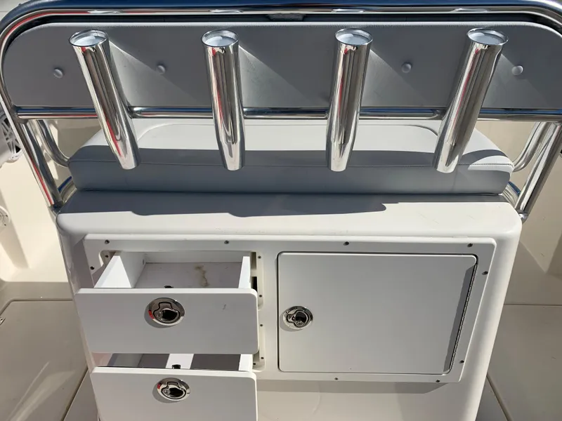 Slide: The Image of Cobia 237 Center Console 2020 with rod holders and storage compartments. - 12