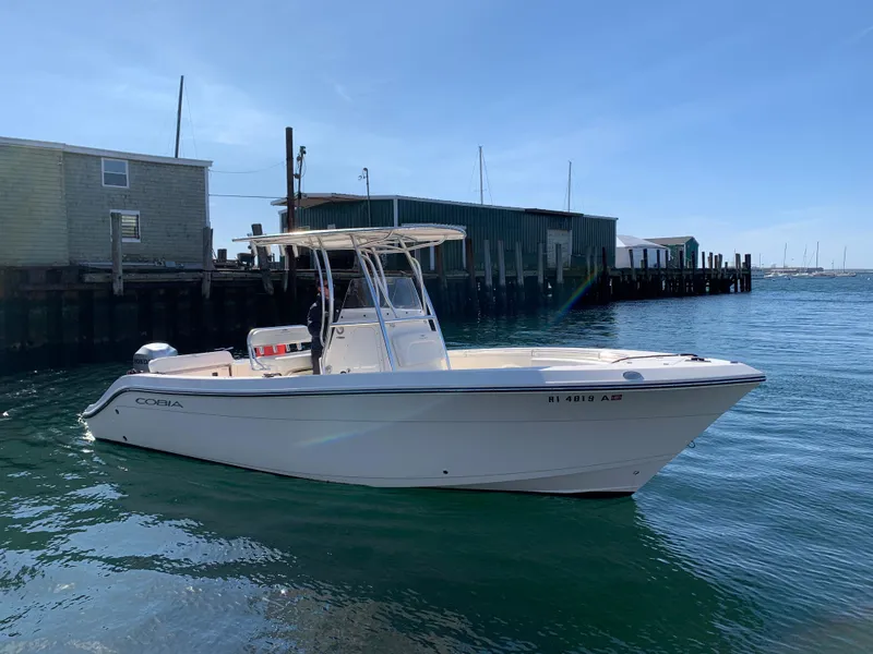 Slide: The Image of 2020 Cobia 237 Center Console boat in harbor. - 6