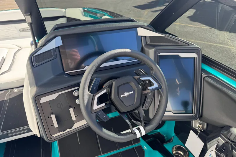 Slide: The Image of 2026 Supra SA 575 boat dashboard with modern steering and dual touchscreens. - 6