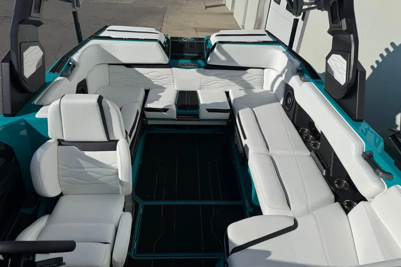 Slide: The Image of 2026 Supra SA 575 boat interior with luxurious white seating and modern design. - 9