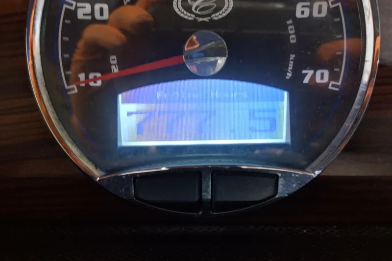 Slide: The Image of Close-up of a 2015 Cobalt 24SD speedometer displaying 777.5 engine hours. - 17