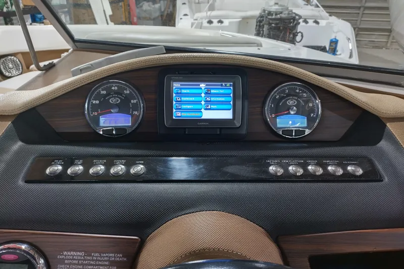 Slide: The Image of Dashboard of a 2015 Cobalt 24SD boat with gauges and touchscreen display. - 18